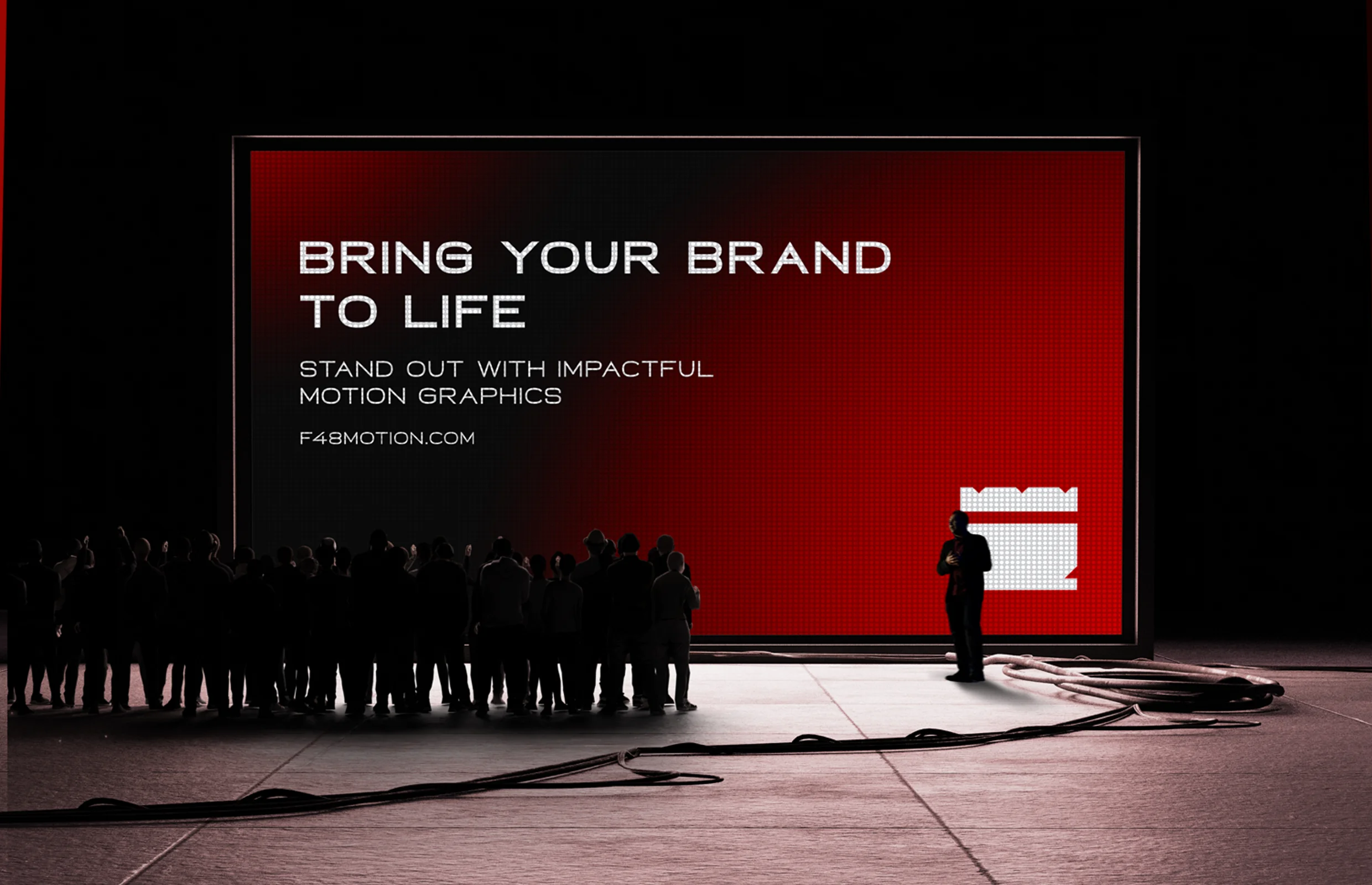 Publicidad de F48 Motion Design en pantalla gigante con fondo rojo y eslogan "Bring Your Brand to Life".